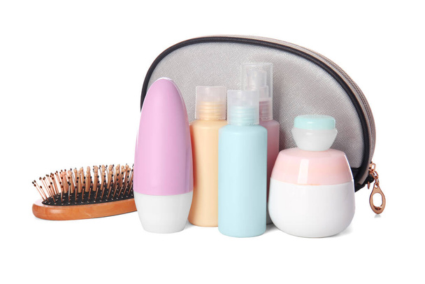 Cosmetic bag and set of travel bottles with cosmetic products on white background - Photo, Image