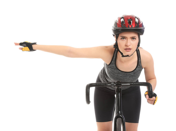 白い背景に自転車に乗る女性サイクリスト - 写真・画像