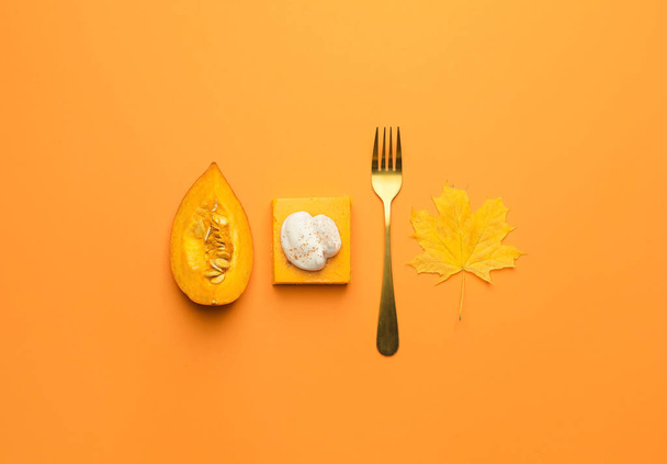Piece of tasty pumpkin pie and fork on color background - Photo, Image