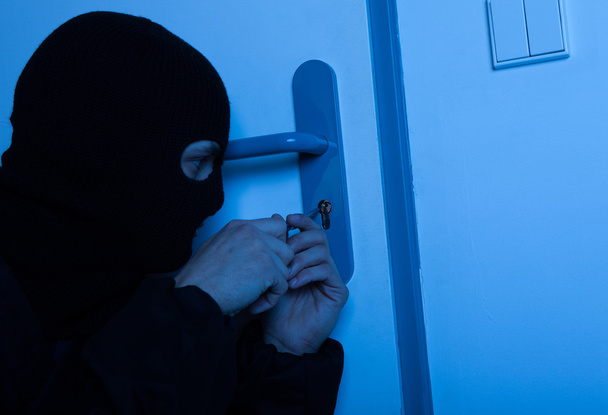 Thief Opening House Door With Tool - Foto, Imagen