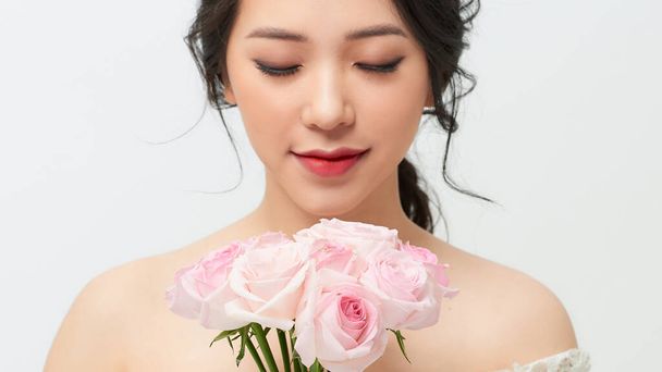 very nice sensual girl with bouquet of roses - 写真・画像