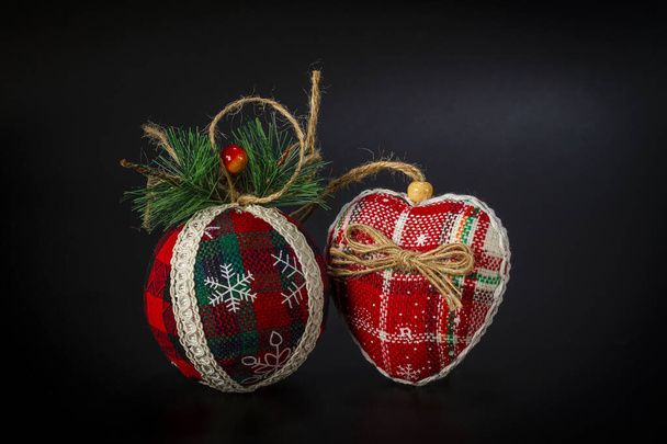 Beautiful Christmas toys made of fabric on a black background. - Photo, Image