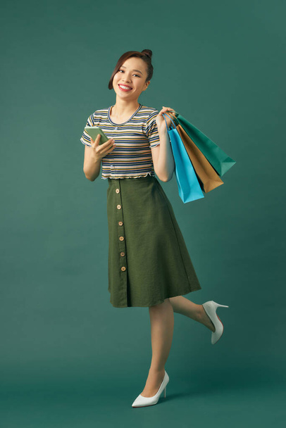 Beautiful Attractive Asian Woman holding shopping bags  - Foto, afbeelding