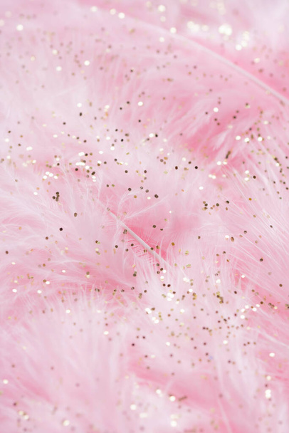 Pink fluffy feathers with gold glitter - Photo, Image