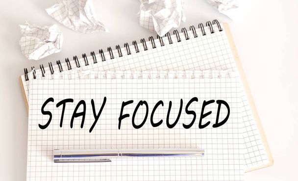 Word writing text Stay focused . Business concept on the notebook - Foto, Imagem