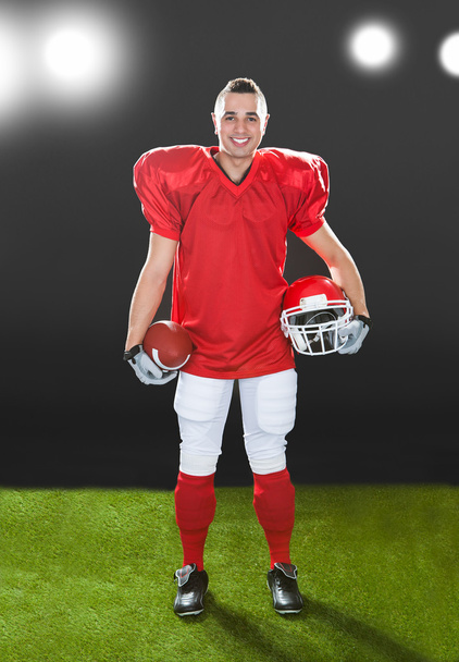 Portrait Of Smiling American Football Player - Foto, afbeelding