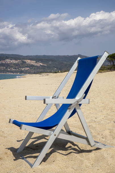 a deckchair on the beach - Fotó, kép