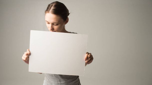 Girl holding white blank sign - Photo, Image