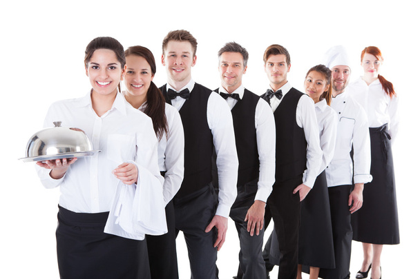 Large group of waiters and waitresses standing in row - Photo, image