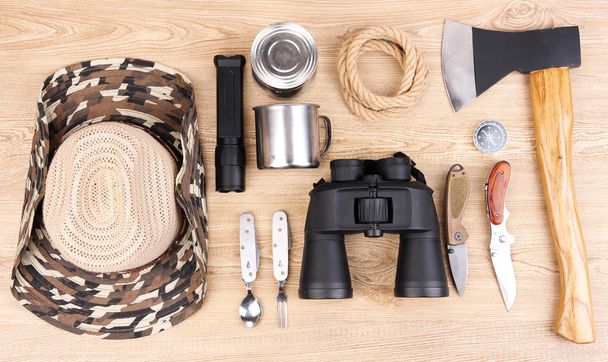 Equipment for trekking on wooden background - Valokuva, kuva