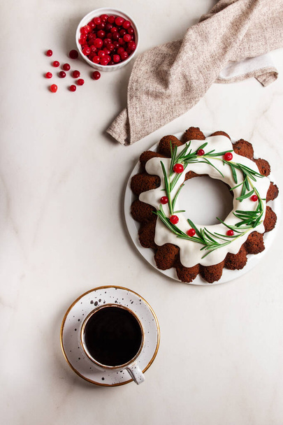 Traditional Christmas cake decorated white glaze and coffe over light background. Bundt cake. Top view. - Foto, immagini