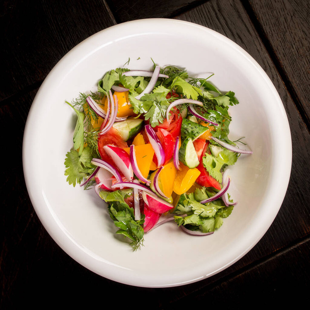 fresh salad of vegetables and herbs, a ready-made dish for creating a menu - Φωτογραφία, εικόνα
