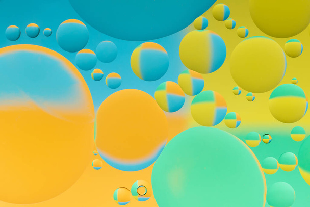 colorful abstract background with oil drops on water - Foto, afbeelding