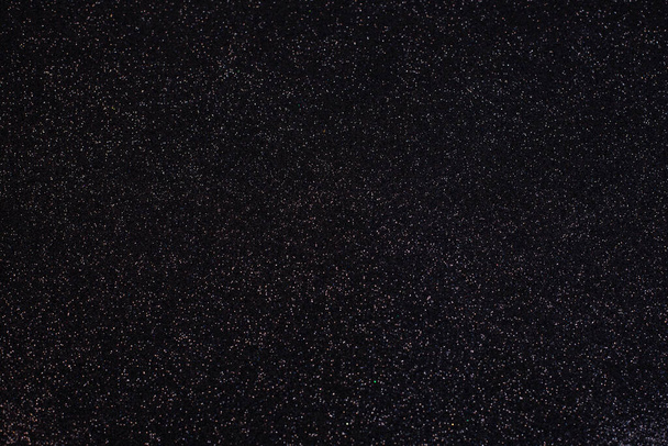 Ezüst csillogás fekete háttérrel. A tervezés háttere - Fotó, kép