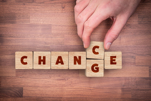 Change is your chance motivational concept. Mentor motivate to change and to take opportunity in post covid-19 era after pandemic. Wooden cubes with text change transformed to the word change, flat lay top down view design. - Foto, Bild