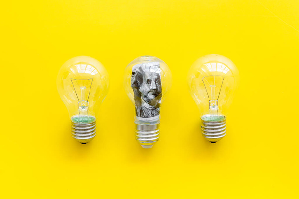 Save money and energy power concept - dollar in light bulb - Valokuva, kuva
