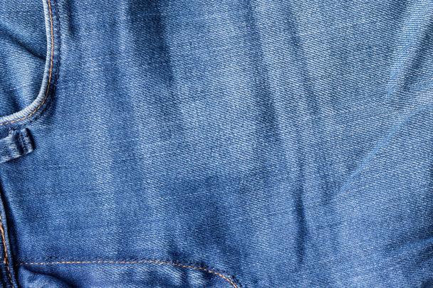 Niebieskie dżinsy tekstury tkaniny. Dżinsy z przednią kieszenią tłem - Zdjęcie, obraz