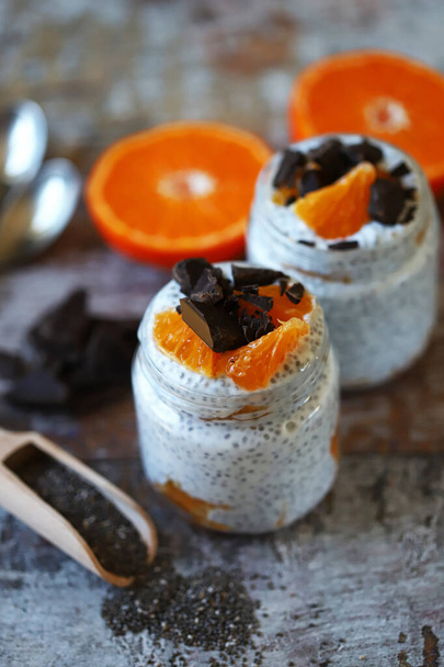 Chia yogurt with fruits and chocolate. Healthy breakfast or dessert. Diet concept. - Photo, Image