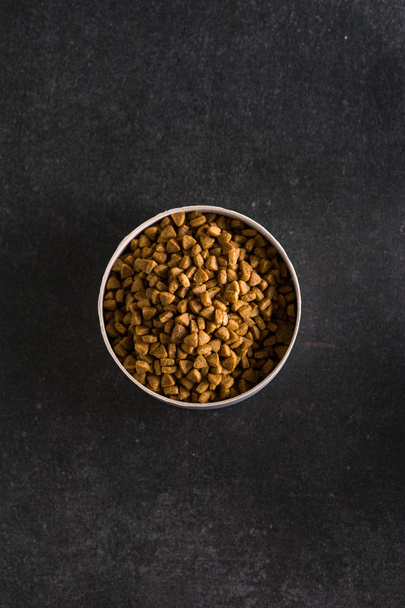 Premium natural dry food for cats and dogs. Complete food for a good activity and a healthy life for your pet. Top view of granules - Photo, Image