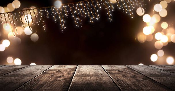Wooden holiday empty table, night view, blurred bokeh lights background. - Фото, изображение