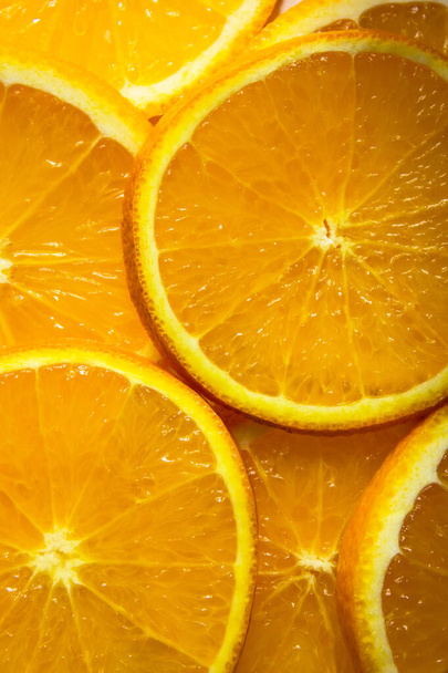 fondo naranja brillante de rodajas de naranjas jugosas  - Foto, imagen