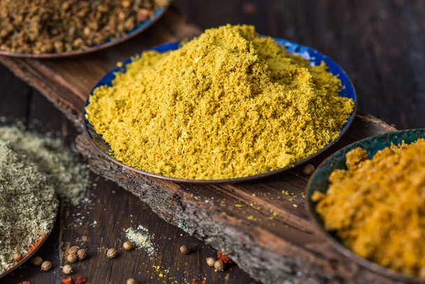 Heaps of various ground spices on wooden background. Georgian spices, Indian spices, Arabian spices. Spice variety. Herbs and spic. Condiment, black. - Φωτογραφία, εικόνα