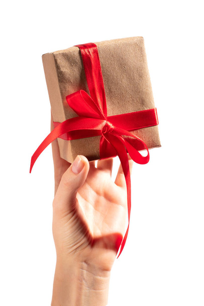Gift with red ribbon in hand - Foto, immagini