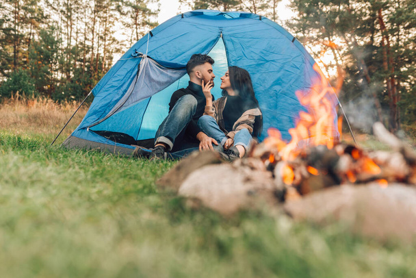 Romantic couple sitting in tent - Photo, Image