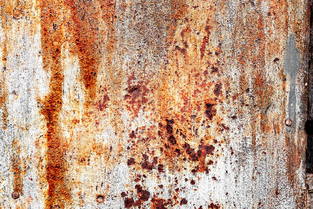 Texture of a metal wall with cracks and scratches which can be used as a background - Foto, Imagen