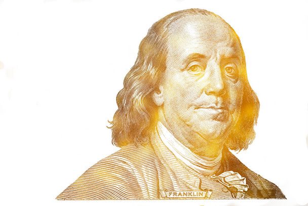 golden textured Benjamin Franklin cut on new 100 dollars banknote isolated  - Photo, Image