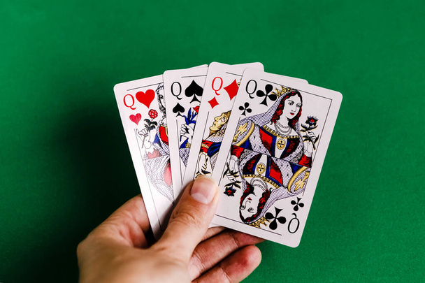 Poker quads playing card, green background - Foto, Bild