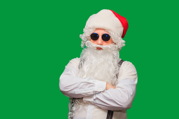 Portrait of stylish Santa Claus on color background - 写真・画像