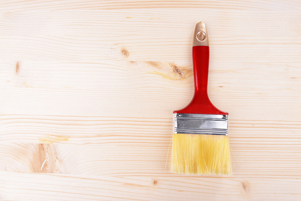 Applying protective varnish to wooden board close-up - Fotó, kép