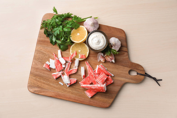 Delicious crab sticks served on wooden table, top view - Zdjęcie, obraz