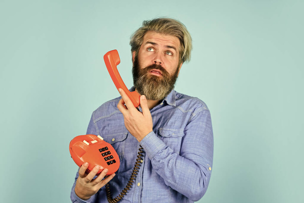 no answer. vintage communication device. Businessman talking on vintage phone in his office. agile business. vintage stationary telephone. hello 80s. Man with moustache holding vintage phone - Foto, immagini