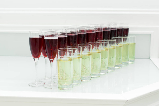 Festive buffet table with alcoholic drinks in the glasses. - Photo, image