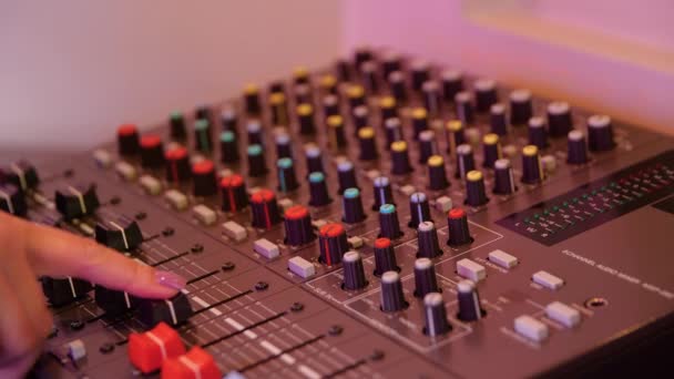 Close-up of man setting up mixing console. Media. Recording equipment with sound engineers mixing console. Recording Studio with small mixing console - Footage, Video