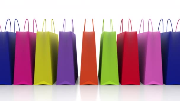 Elszigetelt bevásárló táskák a fehér háttér és az értékesítés előestéjén az ünnepek - Felvétel, videó