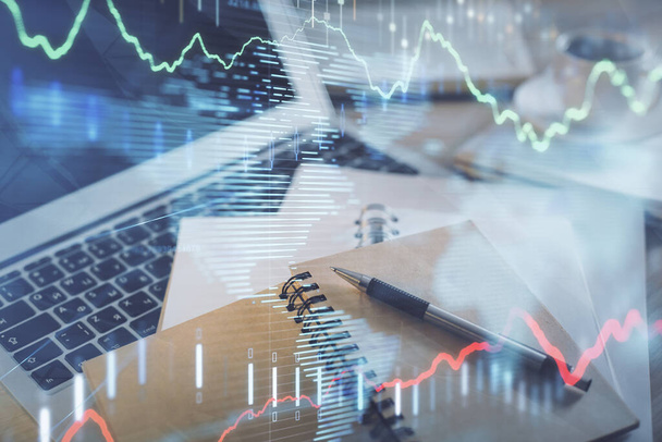 Double exposure of financial chart drawing and desktop with coffee and items on table background. Concept of forex market trading - Fotografie, Obrázek