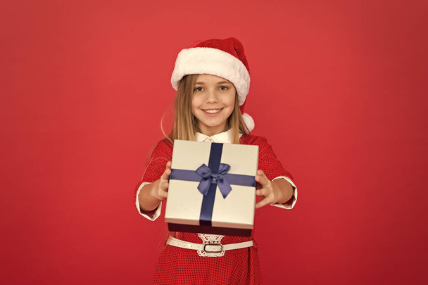 Present for you. Happy child give present box. Little girl smile with xmas present. Wrapped gift. Saint Nicholas Day. Christmas eve. Boxing day. New year. Present from Santa Claus - Φωτογραφία, εικόνα