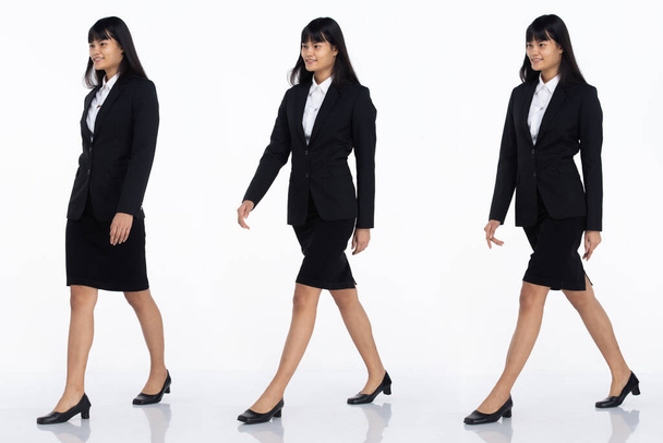 Three Collage Full length of 20s Asian office business Woman black short hair wear dark suit skirt and shoes. Female walk toward side view to camera over white Background isolated - Foto, Imagen