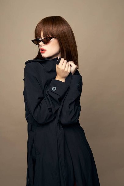 Funny woman dark coat elegant style smiling studio  - Photo, Image