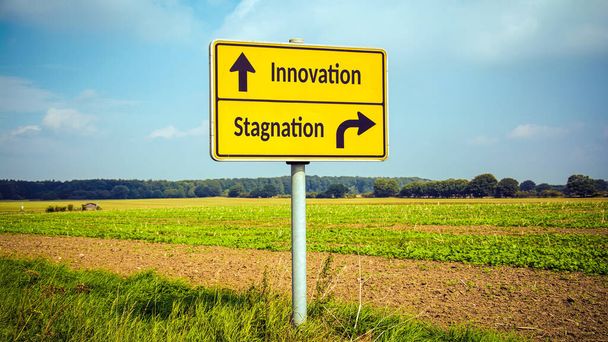 Street Sign the Direction Way to Innovation versus Stagnation - Photo, Image