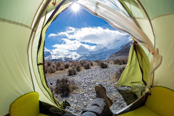 Hiker enjoy the beautiful landscape in tent - Fotografie, Obrázek