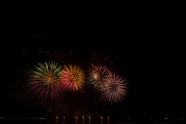 Fireworks and fireworks celebrating black background with copy space - Photo, Image
