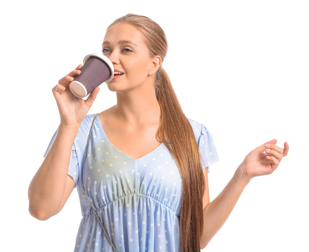 Young woman with stains on her dress drinking coffee on white background - Φωτογραφία, εικόνα