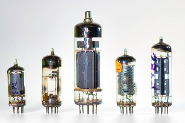 Some old used valves on a white background - Φωτογραφία, εικόνα