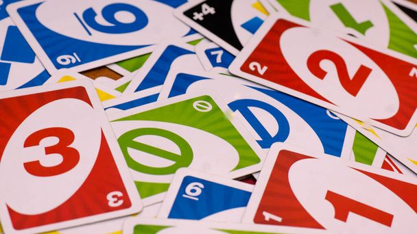 December 2, 2020: view of Uno card game. Scattered cards of the game Uno - Фото, изображение
