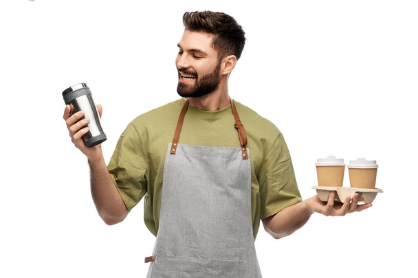 happy waiter with takeout coffee cups and tumbler - Zdjęcie, obraz