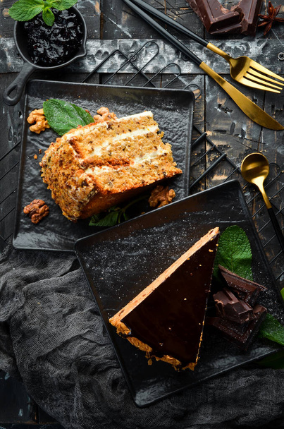 Delicious nut cake on a black stone plate. Top view. Rustic style. - 写真・画像